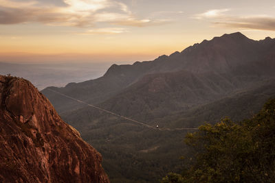 Scenic view of mountains against sky during sunset