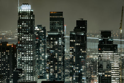 Illuminated buildings in city at night