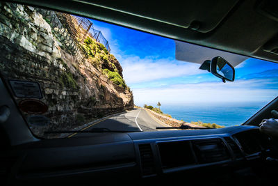 Panoramic shot of car on sea against sky