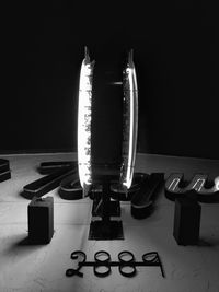 Close-up of piano keys against black background