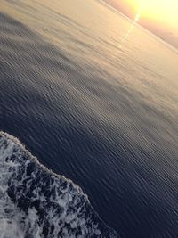 High angle view of sea against sky during sunset