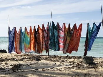 Coloured fabrics at a beach