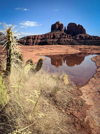 Rock formations on landscape against sky