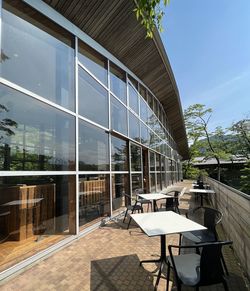 Empty chairs and tables in greenhouse