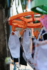 Clothes hanging on clothesline against white background