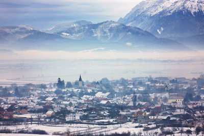 High angle view of town against cloudy sky