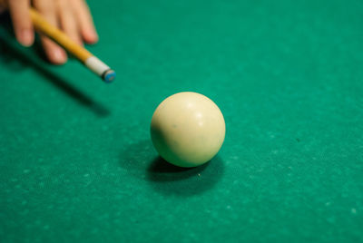 Person playing with ball on table