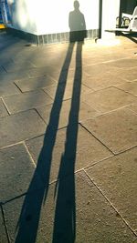 Shadow of people on wall