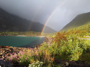 Rainbow over mountain against sky