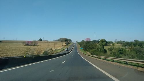 Empty road along landscape