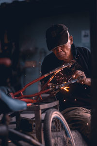 Blacksmith working in workshop