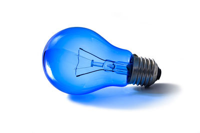 Close-up of light bulbs against white background