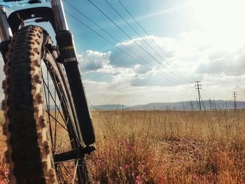 Field against cloudy sky