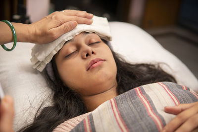 Close-up of young woman sleeping at home