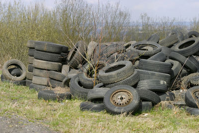 Stack of abandoned truck on field