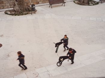 Full length of woman standing by railing