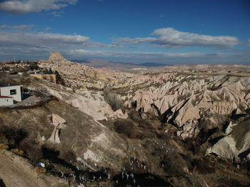 Aerial view of landscape against cloudy sky