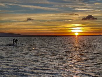 Scenic view of calm sea at sunset