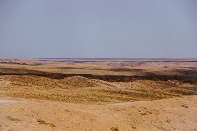 Scenic view of desert against clear sky