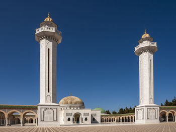 View of historic building against clear blue sky