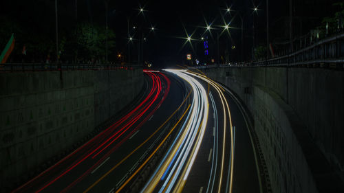 High angle view of light trails on road at night