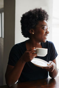 Young man drinking coffee cup