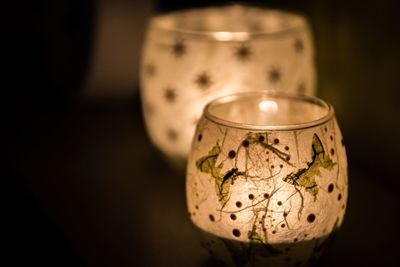 Close-up of illuminated lamp in darkroom