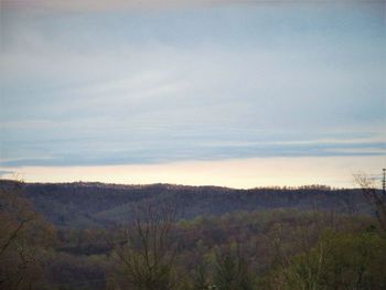 Scenic view of field against sky during sunset