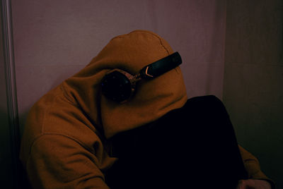 Midsection of man using mobile phone at home