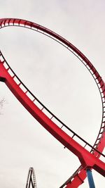 Low angle view of ferris wheel against clear sky