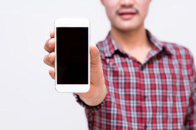 Low angle view of man using mobile phone