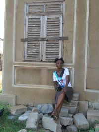 Full length of woman standing on steps