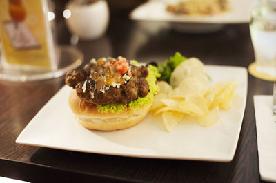 Close-up of burger in plate on table