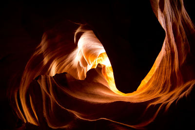 Close-up of rock formation against black background