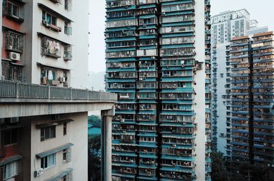 Low angle view of buildings in city against sky