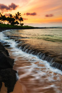 Scenic view of sea against sky during sunset