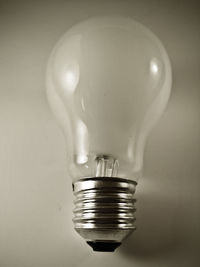 Close-up of light bulb on table