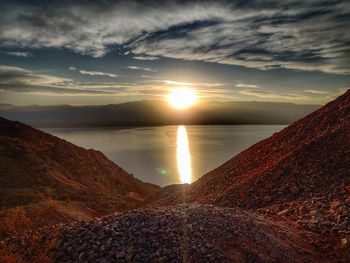 Scenic view of beach against sky during sunset