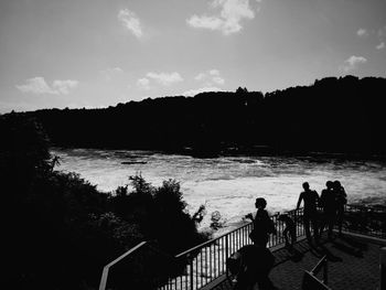 Silhouette of people in water