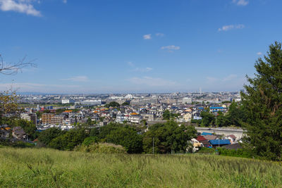 View of townscape against blue sky