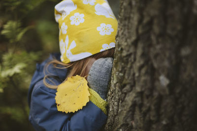 Girl playing hide and seek