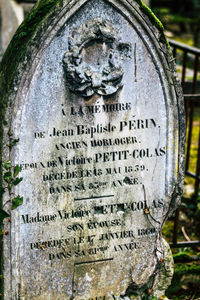 Close-up of text on stone at cemetery