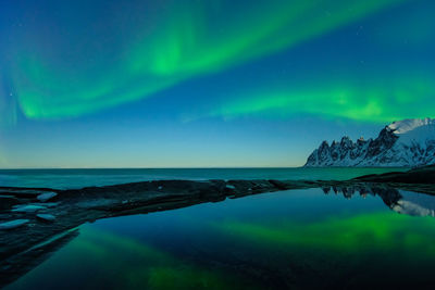 Scenic view of sea against sky at night