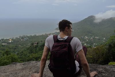 Young man looking at mountains