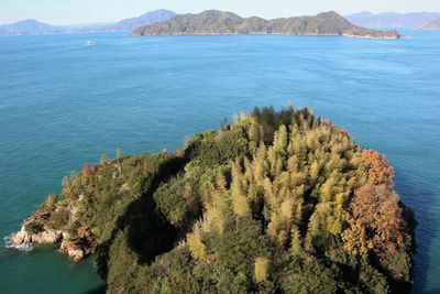 High angle view of sea, islands and mountains