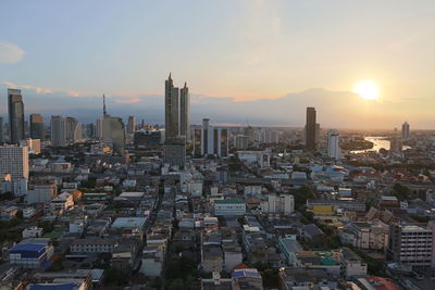 High angle view of buildings against sky during sunset