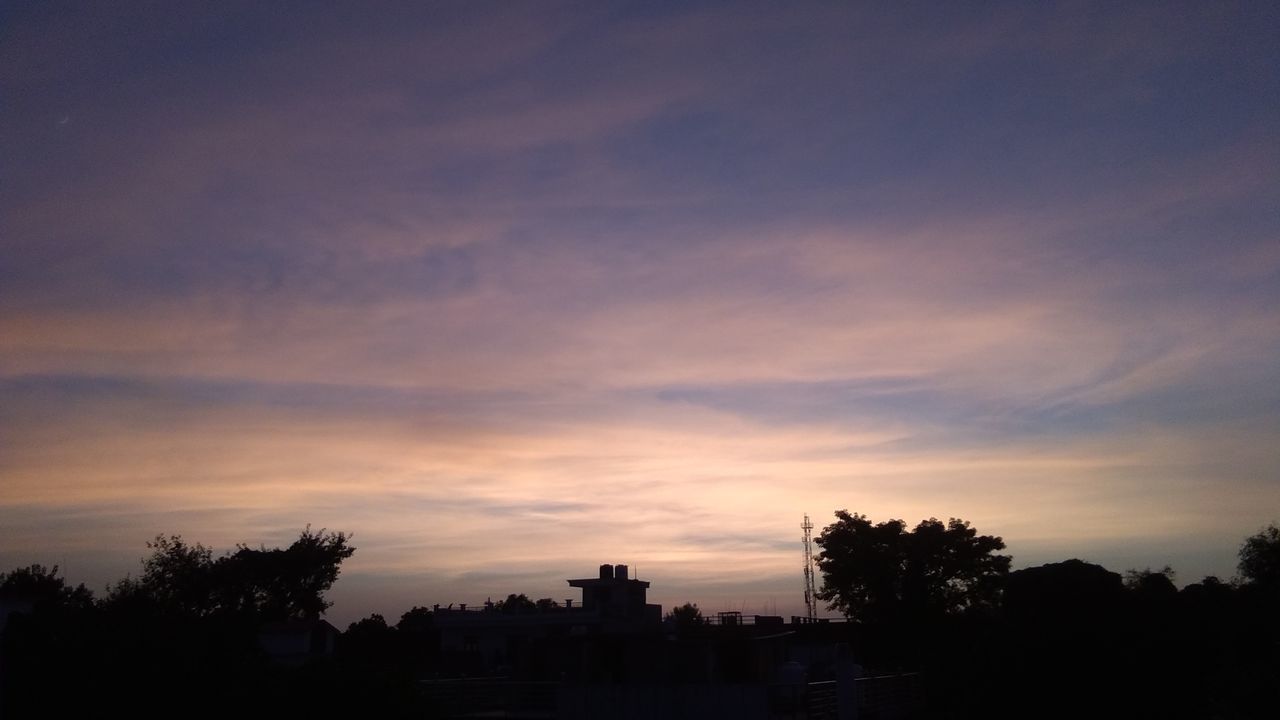 SILHOUETTE TREES AND BUILDING AGAINST SKY AT SUNSET