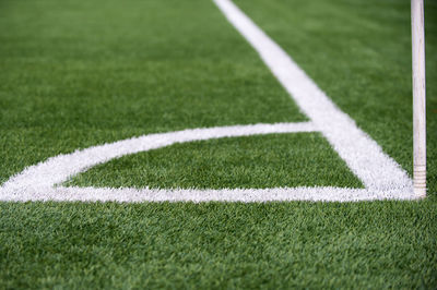 Shadow of woman on soccer field