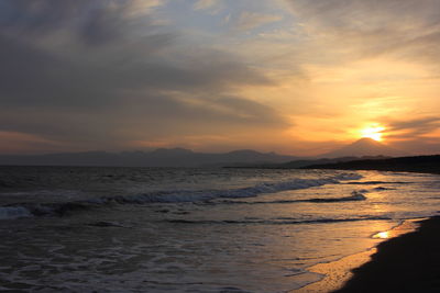 Scenic view of sea at sunset