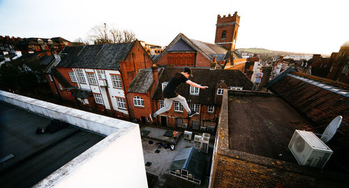 High angle view of buildings in city against clear sky